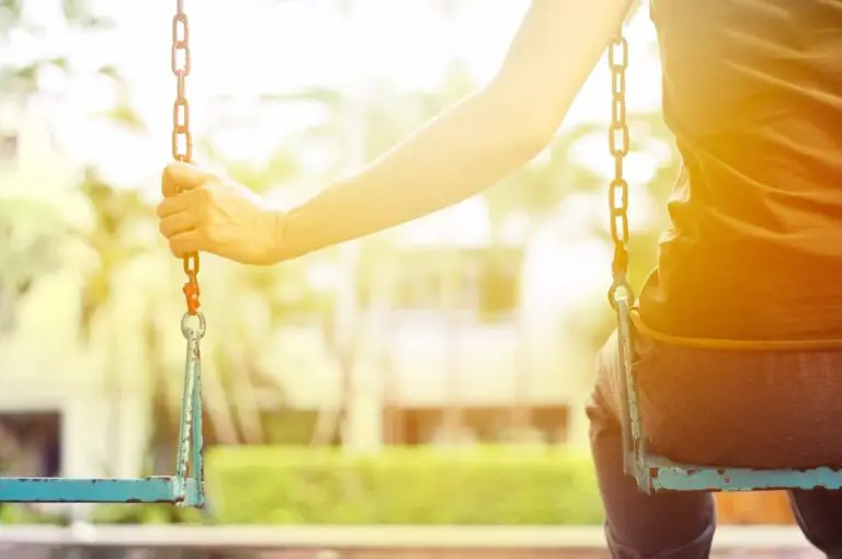 A Woman Sitting on a Swing